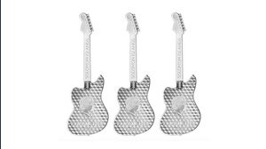 Arriva una moneta rara a forma di chitarra. E i collezionisti impazziscono